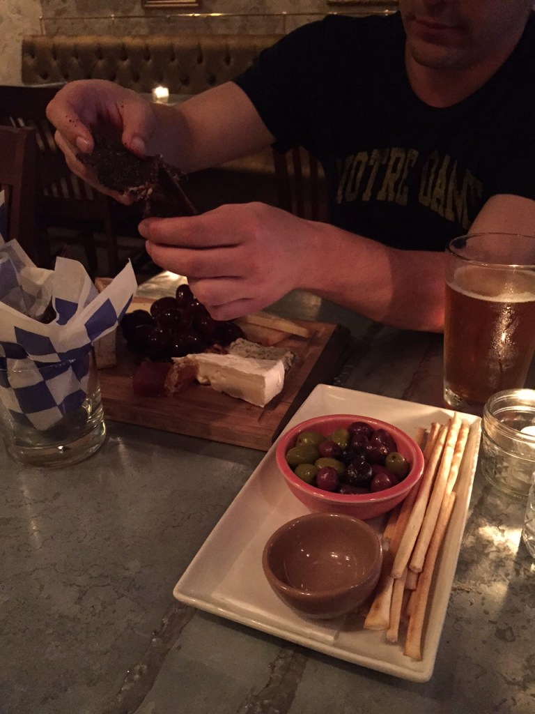 Olives, cheese plate (pretty big for $10!), and peppery beef jerky.